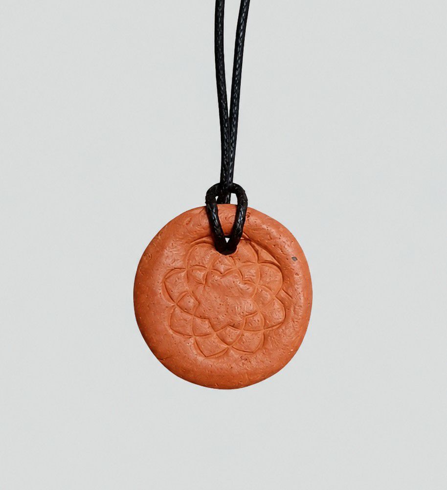 Ceramic Soka Gakkai logo necklace